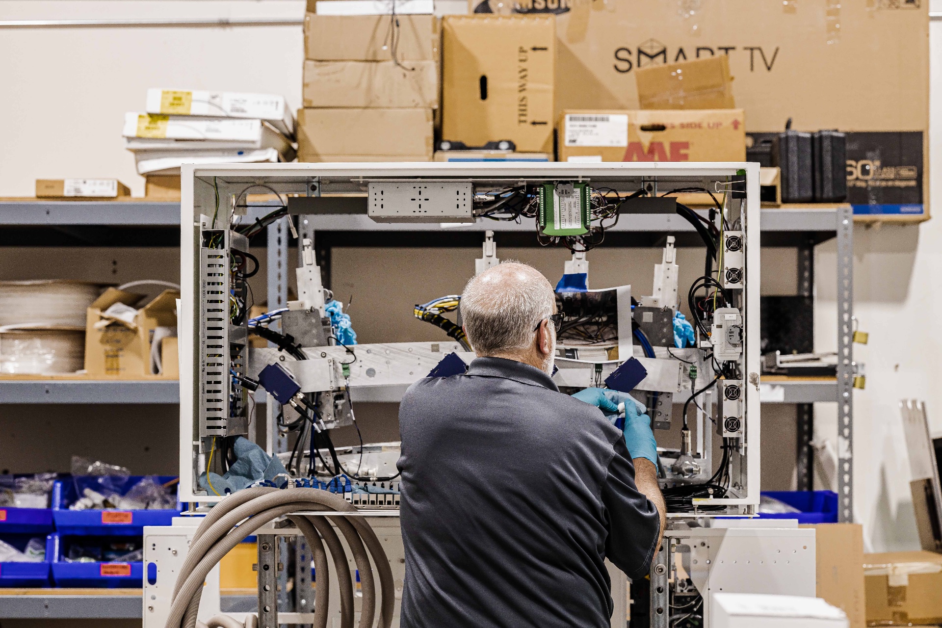 Colordyne service technician working on an inkjet print engine in the service lab